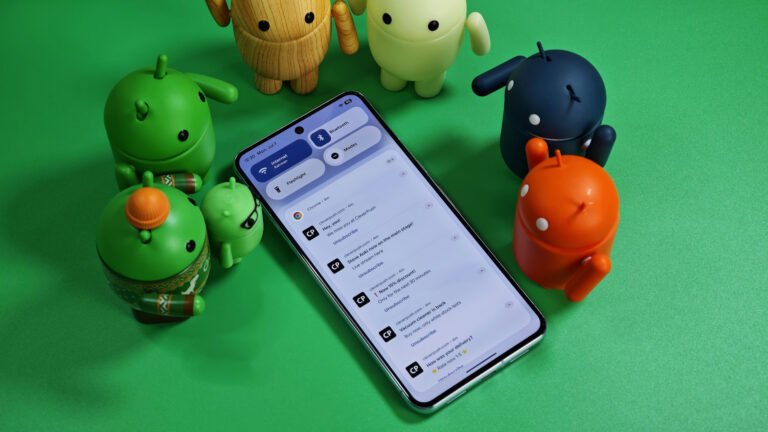 Android-bots-standing-over-a-Pixel-phone-with-various-notifications.jpg